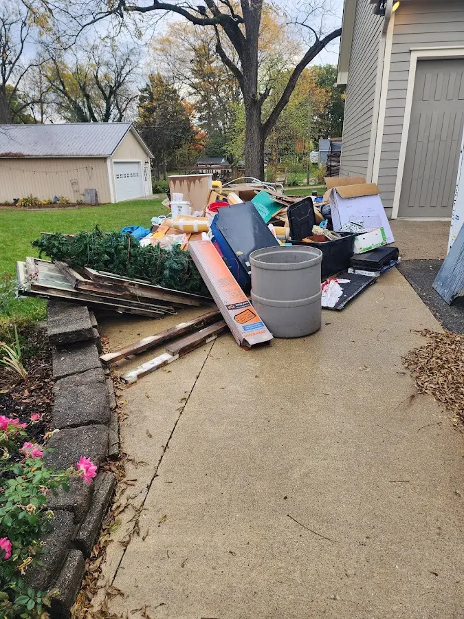 Dumpster being loaded with debris for Residential Dumpster Rental in Winthrop